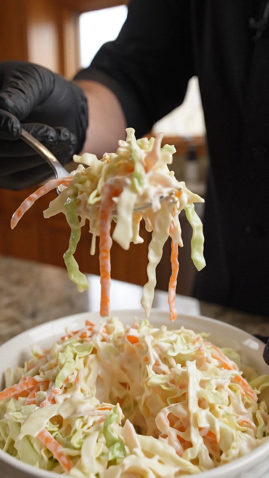 Bowl of classic coleslaw with fresh cabbage and carrots