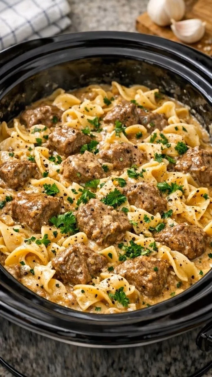Creamy crockpot beef pasta with meatballs served in a bowl