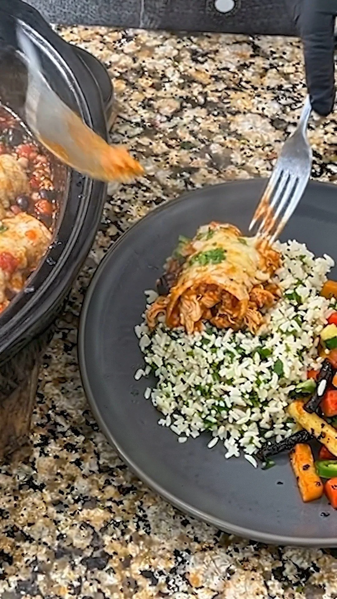 Easy slow-cooker chicken enchiladas served on a plate with toppings