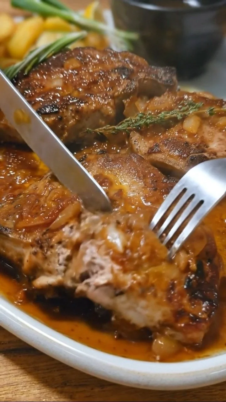 Delicious homemade gravy in a bowl with serving spoon