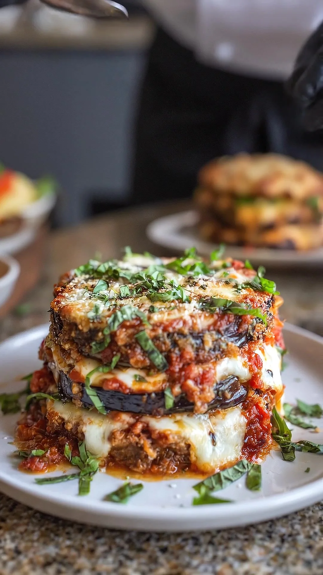 Loaded Cheesy Eggplant Parmesan Stack with layers of eggplant and melted cheese