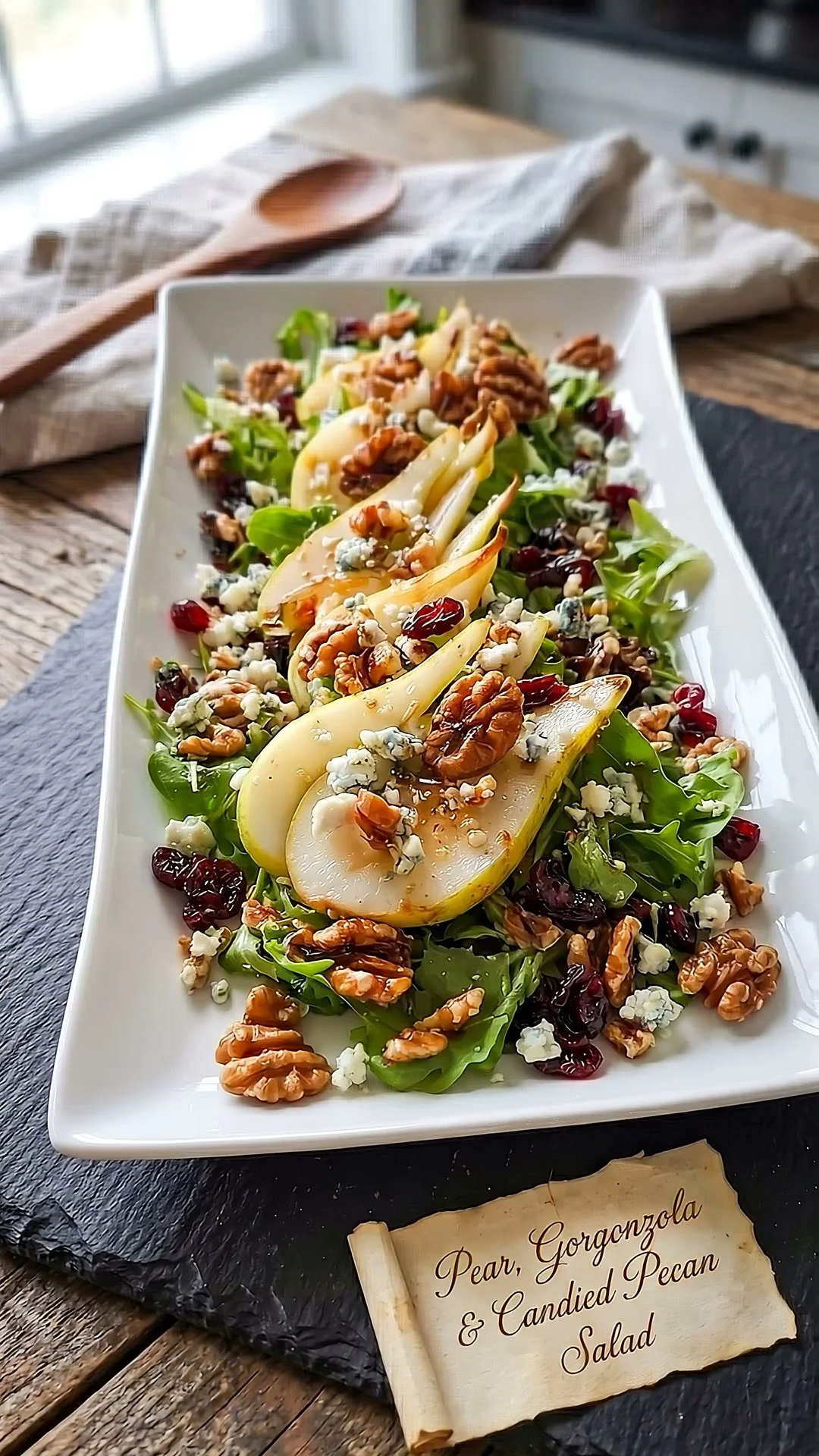 Delicious Pear Gorgonzola Salad with candied pecans on a plate